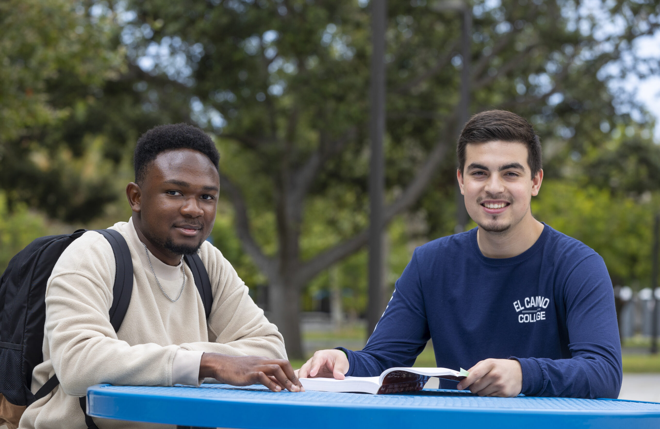 two students studying outdoors at el camino college.